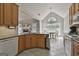 Modern kitchen with granite countertops, stainless steel appliances, and a view to the living room at 215 Murphy Creek Ln, Fayetteville, GA 30215