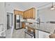 Spacious kitchen with stainless appliances, granite countertops, and a breakfast bar for convenience at 215 Murphy Creek Ln, Fayetteville, GA 30215