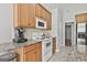 Kitchen featuring stainless appliances, granite countertops, and oak cabinets for a modern touch at 215 Murphy Creek Ln, Fayetteville, GA 30215
