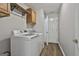 Functional laundry room featuring a washer, dryer, and storage at 215 Murphy Creek Ln, Fayetteville, GA 30215