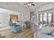 Open-concept living room showcasing seamless flow to dining area and a cozy atmosphere at 215 Murphy Creek Ln, Fayetteville, GA 30215