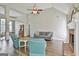 Inviting living room with vaulted ceiling, fireplace, and hardwood floors offers a warm ambiance at 215 Murphy Creek Ln, Fayetteville, GA 30215