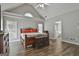 Spacious main bedroom featuring wood floors and a vaulted ceiling at 215 Murphy Creek Ln, Fayetteville, GA 30215