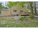 View of the home's rear exterior with a backyard deck and landscaping at 131 Sweetgum Rd, Peachtree City, GA 30269