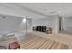 Finished basement space is decorated in neutral tones and is well-lit at 131 Sweetgum Rd, Peachtree City, GA 30269