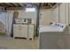 Finished basement laundry area features white cabinets and modern washing machine and dryer at 131 Sweetgum Rd, Peachtree City, GA 30269