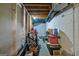 Unfinished basement storage space with exposed beams and concrete walls at 131 Sweetgum Rd, Peachtree City, GA 30269