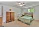 Bedroom with neutral walls, light carpet, and simple furnishings at 131 Sweetgum Rd, Peachtree City, GA 30269