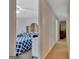 View into bedroom with decorative wood headboard and blue and white patterned bedding from hallway at 131 Sweetgum Rd, Peachtree City, GA 30269