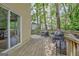 Wooden deck with outdoor seating and sliding door access at 131 Sweetgum Rd, Peachtree City, GA 30269