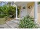 Exterior of the house highlighting the front steps leading to a white front door and decorative plants at 131 Sweetgum Rd, Peachtree City, GA 30269