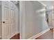 Hallway featuring gray walls, white crown molding and hardwood floors at 131 Sweetgum Rd, Peachtree City, GA 30269