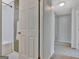 Hallway view with door to the tiled shower bathroom at 131 Sweetgum Rd, Peachtree City, GA 30269