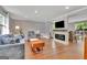 Spacious living room with hardwood floors, fireplace, and comfortable seating arrangement at 131 Sweetgum Rd, Peachtree City, GA 30269
