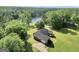 Aerial view of the property, showing the backyard, driveway and proximity to the lake at 70 Lake Charles Xing, Covington, GA 30016