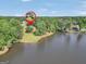 Aerial view of the property, showing the home's location near a lake at 70 Lake Charles Xing, Covington, GA 30016