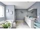 Bathroom featuring a soaking tub, double vanity, and modern decor at 70 Lake Charles Xing, Covington, GA 30016