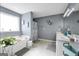 Bright bathroom with a garden tub, dual sink vanity, and modern fixtures and decorations at 70 Lake Charles Xing, Covington, GA 30016