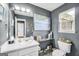 Bathroom with gray walls, a large mirror and some decor at 70 Lake Charles Xing, Covington, GA 30016