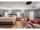 An elegant bedroom design includes a luxurious bed, comfortable seating, and stylish decor for relaxation at 70 Lake Charles Xing, Covington, GA 30016
