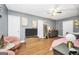 Comfortable bedroom area with hardwood floors, ceiling fan, and contemporary decorations and furnishings at 70 Lake Charles Xing, Covington, GA 30016