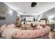 A luxurious bedroom layout is highlighted by a custom sofa, full media center, and a large projector at 70 Lake Charles Xing, Covington, GA 30016