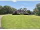 Spacious brick home on a large lot with mature trees at 70 Lake Charles Xing, Covington, GA 30016