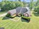Aerial view of brick home with landscaped yard and inviting curb appeal at 70 Lake Charles Xing, Covington, GA 30016