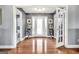 Inviting foyer with hardwood floors, light grey walls, and a view into the living area at 70 Lake Charles Xing, Covington, GA 30016