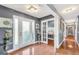 Inviting foyer with hardwood floors, decorative lighting, and a glass-paneled front door at 70 Lake Charles Xing, Covington, GA 30016