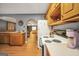 A clean, well-maintained kitchen features wood cabinets and an open layout to an adjacent living area at 70 Lake Charles Xing, Covington, GA 30016