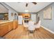 Bright kitchen area with wood cabinetry, appliances, and dining set at 70 Lake Charles Xing, Covington, GA 30016