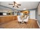 A kitchen and dining area features wood floors and ample counter space for cooking and dining at 70 Lake Charles Xing, Covington, GA 30016