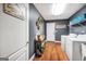 Laundry room with washer and dryer on wood floors and a door to the left at 70 Lake Charles Xing, Covington, GA 30016