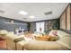 Bright living room with modern decor, L-shaped sofa, decorative pillows and hardwood floors at 70 Lake Charles Xing, Covington, GA 30016