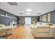 Spacious living area with modern furnishings, fireplace, sleek sofas, and hardwood floors at 70 Lake Charles Xing, Covington, GA 30016