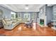 Spacious living room featuring a fireplace and large windows at 70 Lake Charles Xing, Covington, GA 30016