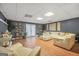 Open-concept living room featuring recessed lighting, stylish decor, and ample space for relaxation at 70 Lake Charles Xing, Covington, GA 30016