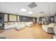 Expansive living and dining area with contemporary furniture, wood flooring, and great natural light at 70 Lake Charles Xing, Covington, GA 30016