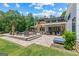 Beautiful backyard featuring patio with seating, manicured lawn, and lush green trees at 159 Sims Rd, Tyrone, GA 30290