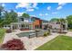 A modern home featuring a luxurious pool, fire bowls, and beautifully landscaped backyard at 159 Sims Rd, Tyrone, GA 30290