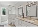 Elegant bathroom with double vanity, stone countertops, modern fixtures, and glass-enclosed shower at 159 Sims Rd, Tyrone, GA 30290