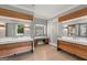 A spacious spa-like main bathroom features a double vanity and a dressing table with a sliding barn door at 159 Sims Rd, Tyrone, GA 30290