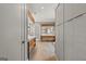 Hallway view into the stunning spa-like main bathroom with wood accents and cabinets at 159 Sims Rd, Tyrone, GA 30290