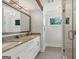 Bathroom featuring double sinks, white cabinetry, tile flooring, and glass shower at 159 Sims Rd, Tyrone, GA 30290