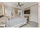 Bedroom featuring neutral tones, hardwood floors, ceiling fan, and entry to en suite bathroom at 159 Sims Rd, Tyrone, GA 30290