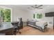 Bedroom featuring windows with natural light, ceiling fan and office desk and chair at 159 Sims Rd, Tyrone, GA 30290