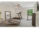 Home exercise room equipped with exercise equipment, fan, and mirror at 159 Sims Rd, Tyrone, GA 30290