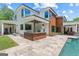 A modern two-story home boasts an outdoor grill station and manicured landscaping at 159 Sims Rd, Tyrone, GA 30290