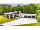 Stunning home showcasing modern architecture, a spacious driveway, and lush landscaping at 159 Sims Rd, Tyrone, GA 30290